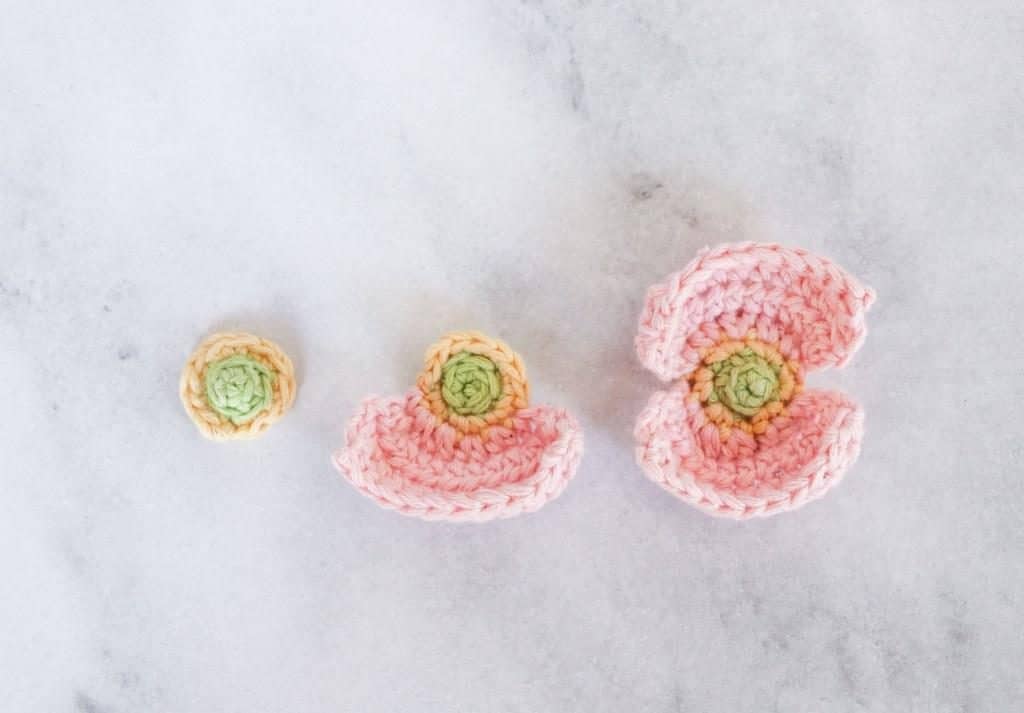 various stages of crochet poppy 