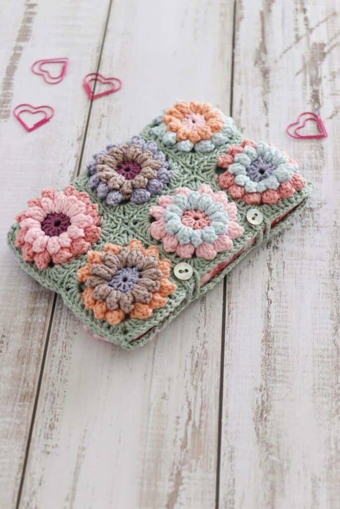 pretty flower pouch made from crochet granny squares