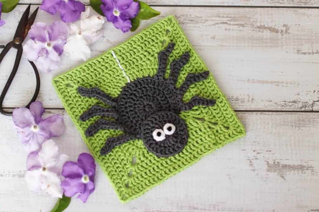 Grey crochet spider on a lime green background