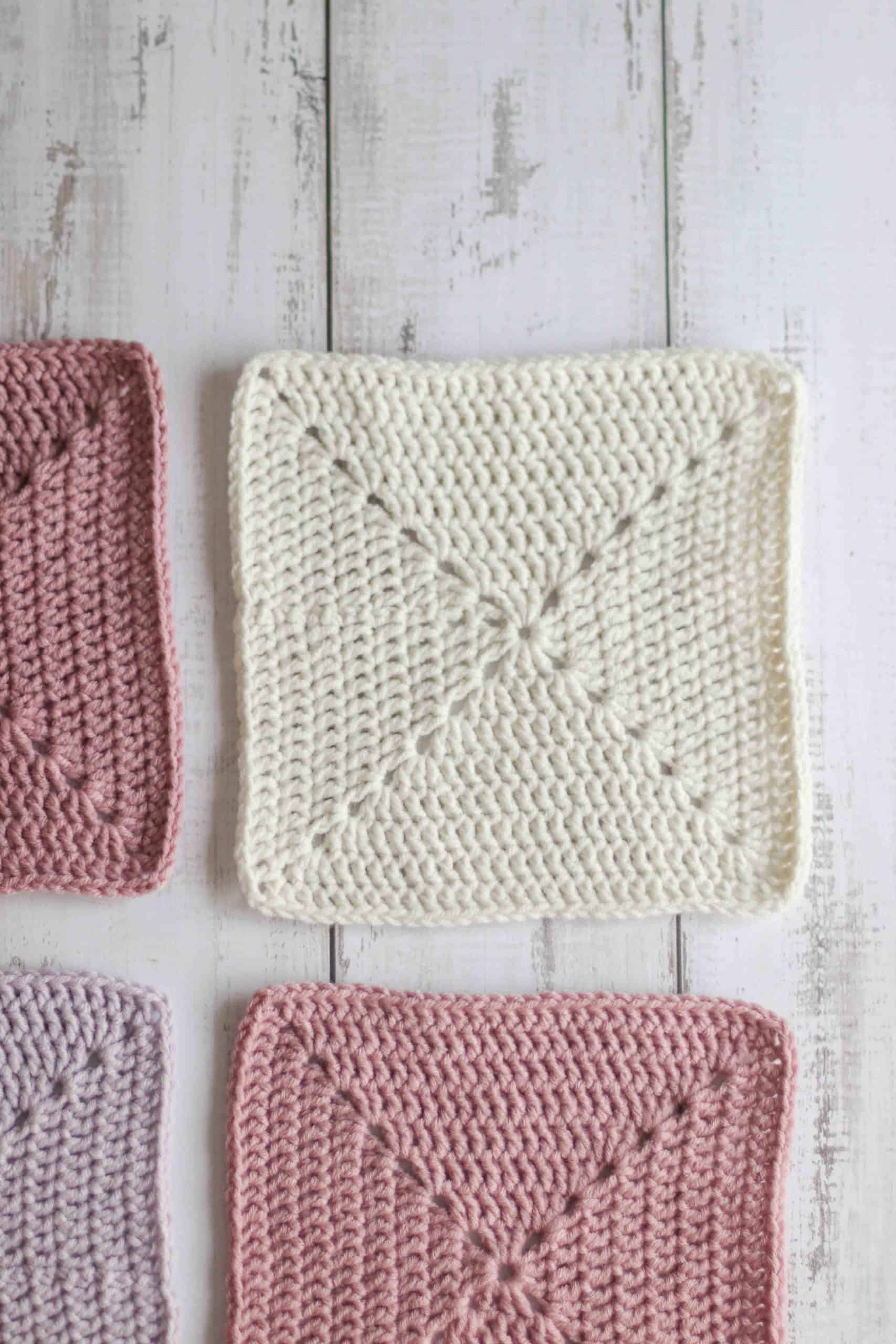 Solid crochet granny square pattern,  cream granny square surrounded by pink solid granny squares
