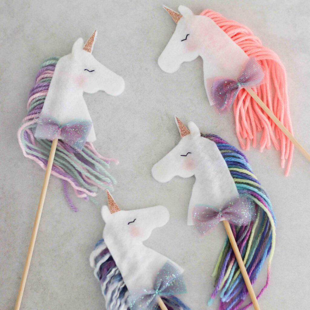 DIY unicorn wands with pastel and glitter manes